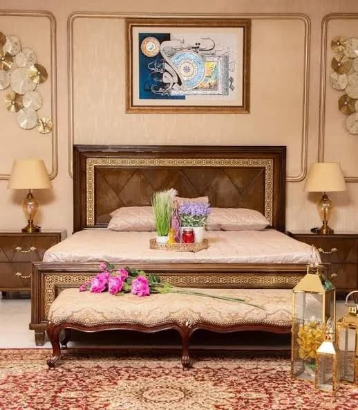 Hand-carved oak bed with a matching upholstered bench.